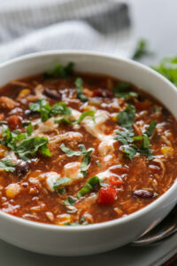 bowl of chicken chili with garnishes