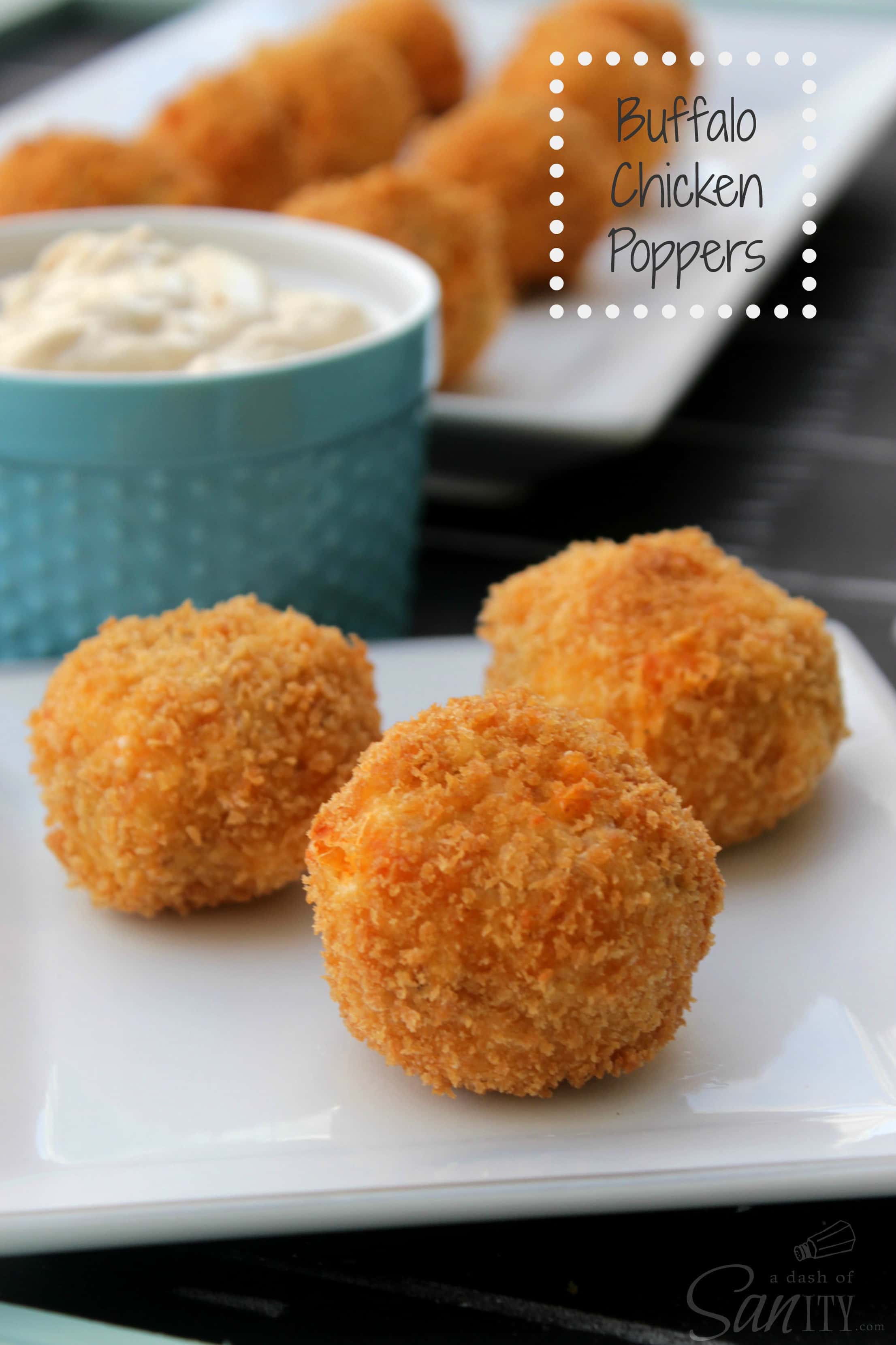 3 Buffalo Chicken Poppers served on a plate with dipping sauce in a bowl in background