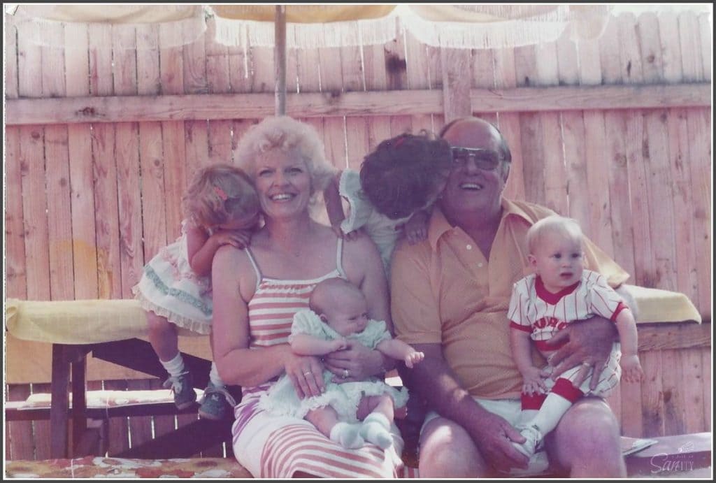 photo of sandra's grandparents with 4 grandchildren siting at a picnic table