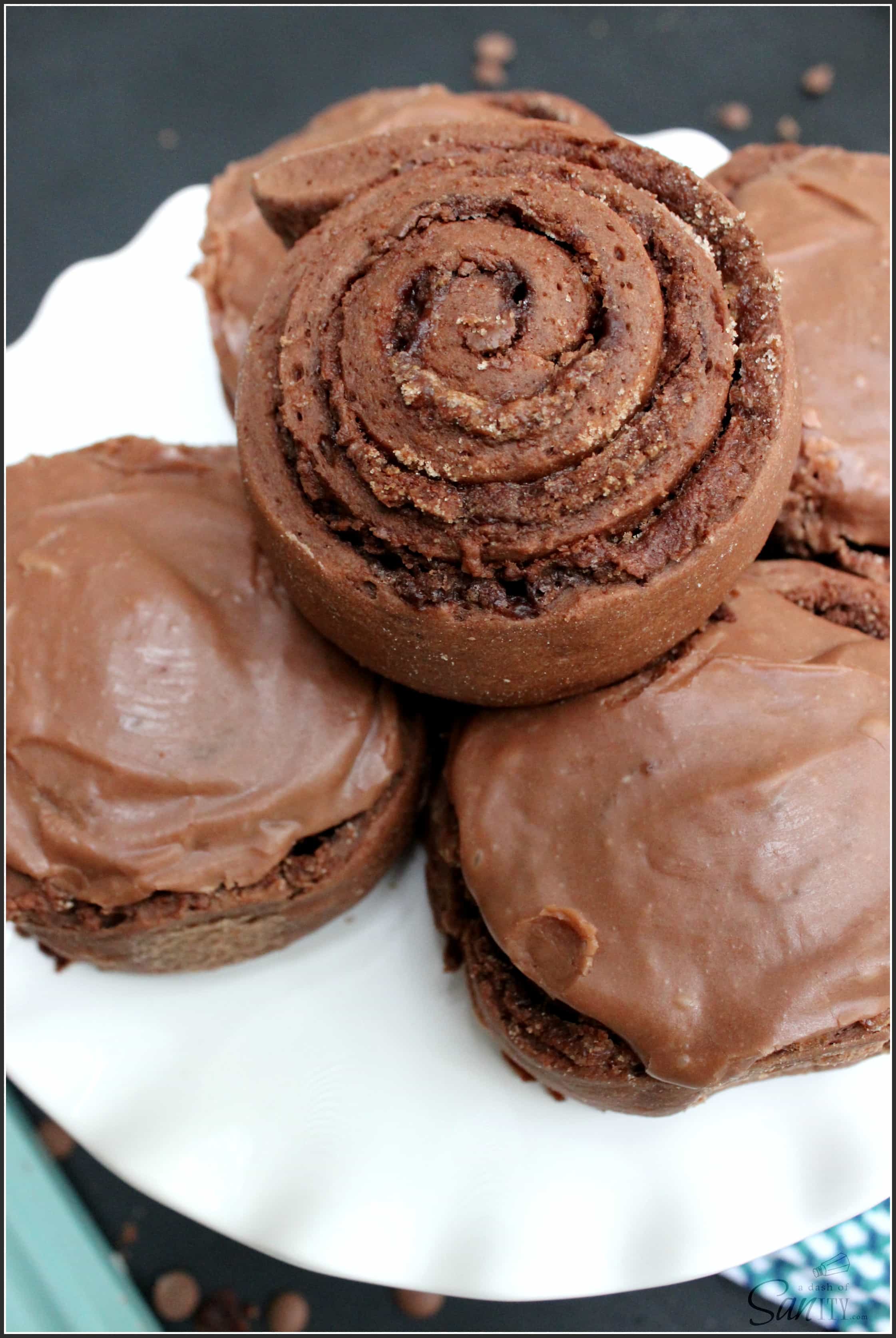 Double Chocolate Nutella Cinnamon Rolls are the best treat ever made. A chocolate sweet roll with a Nutella cinnamon center and fudgey chocolate frosting.