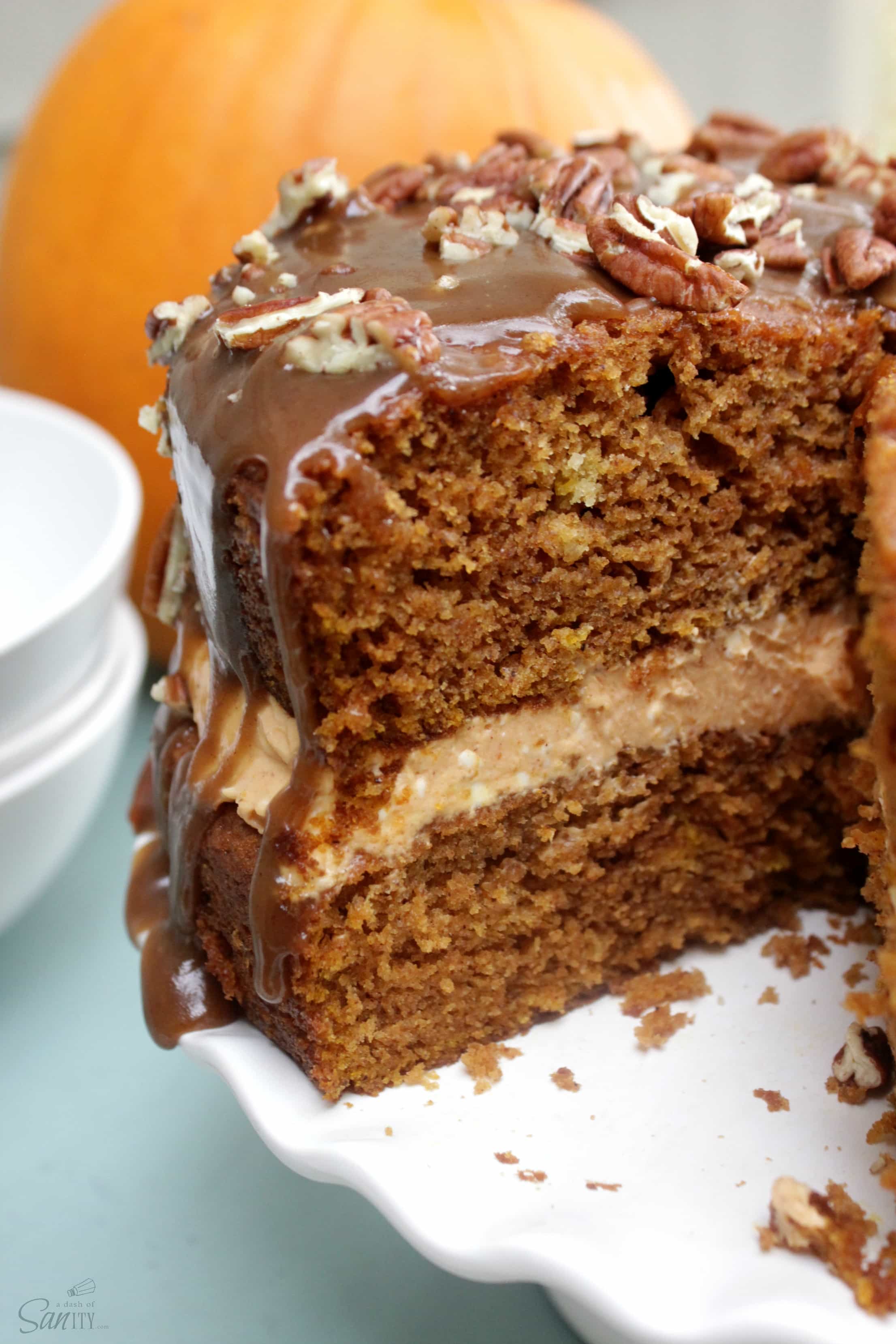 This delicious Caramel Pecan Pumpkin Cake is topped with pumpkin spice caramel sauce & pecans. With this, fall just became your new favorite season.