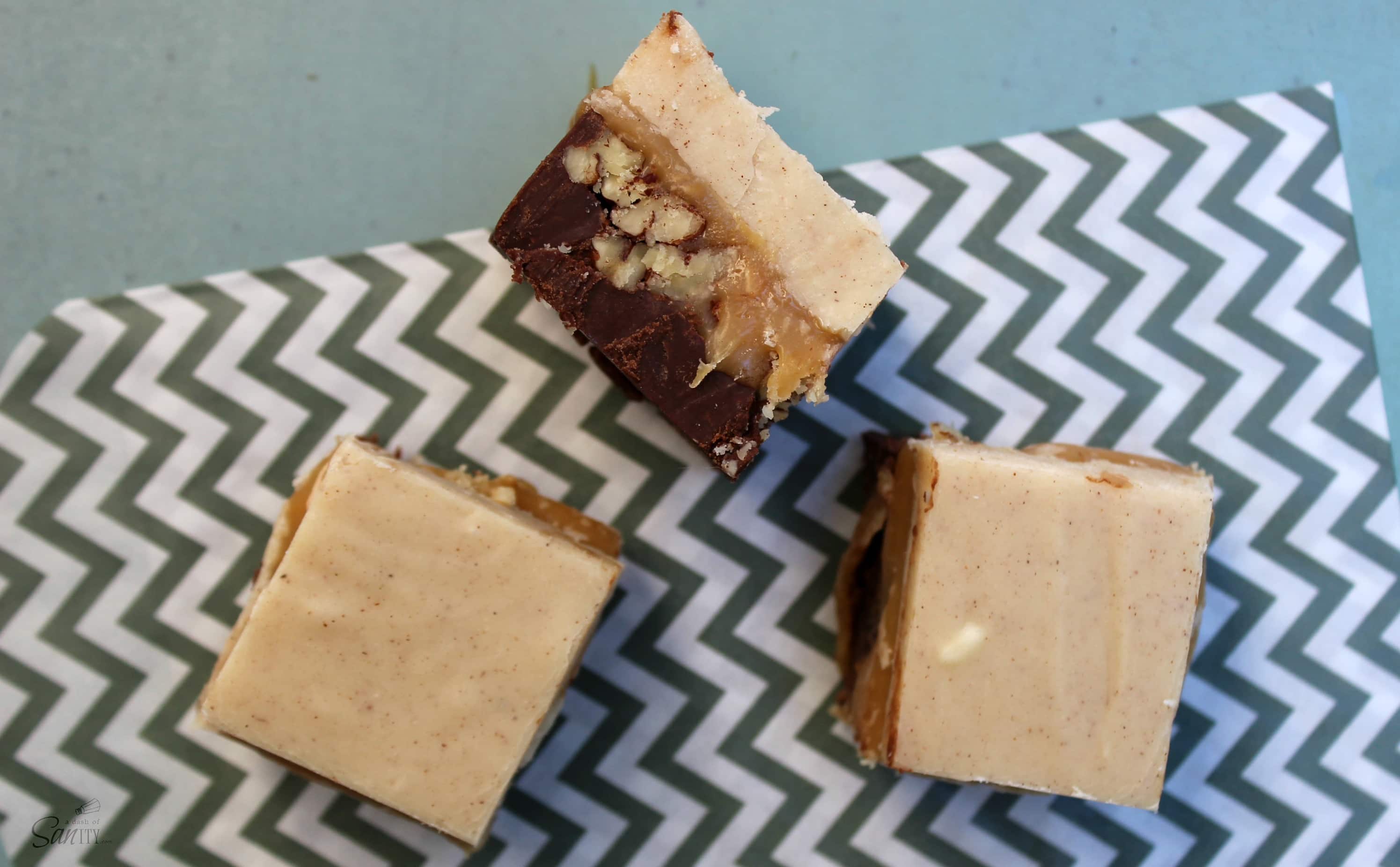 Pumpkin Spice Turtle Fudge is made with layers of chocolate, caramel, and pecans. This traditional fudge recipe just got a new fall twist.