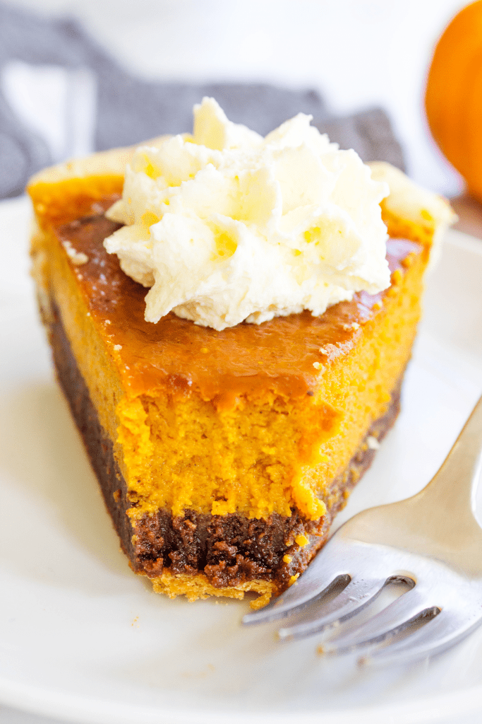 PUMPKIN FUDGE PIE pie crust, fudge layer, pumpkin pie filling, and whipped cream topping