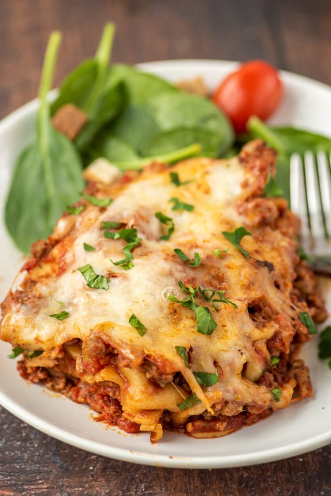 photo of a slice of lasagna on a plate