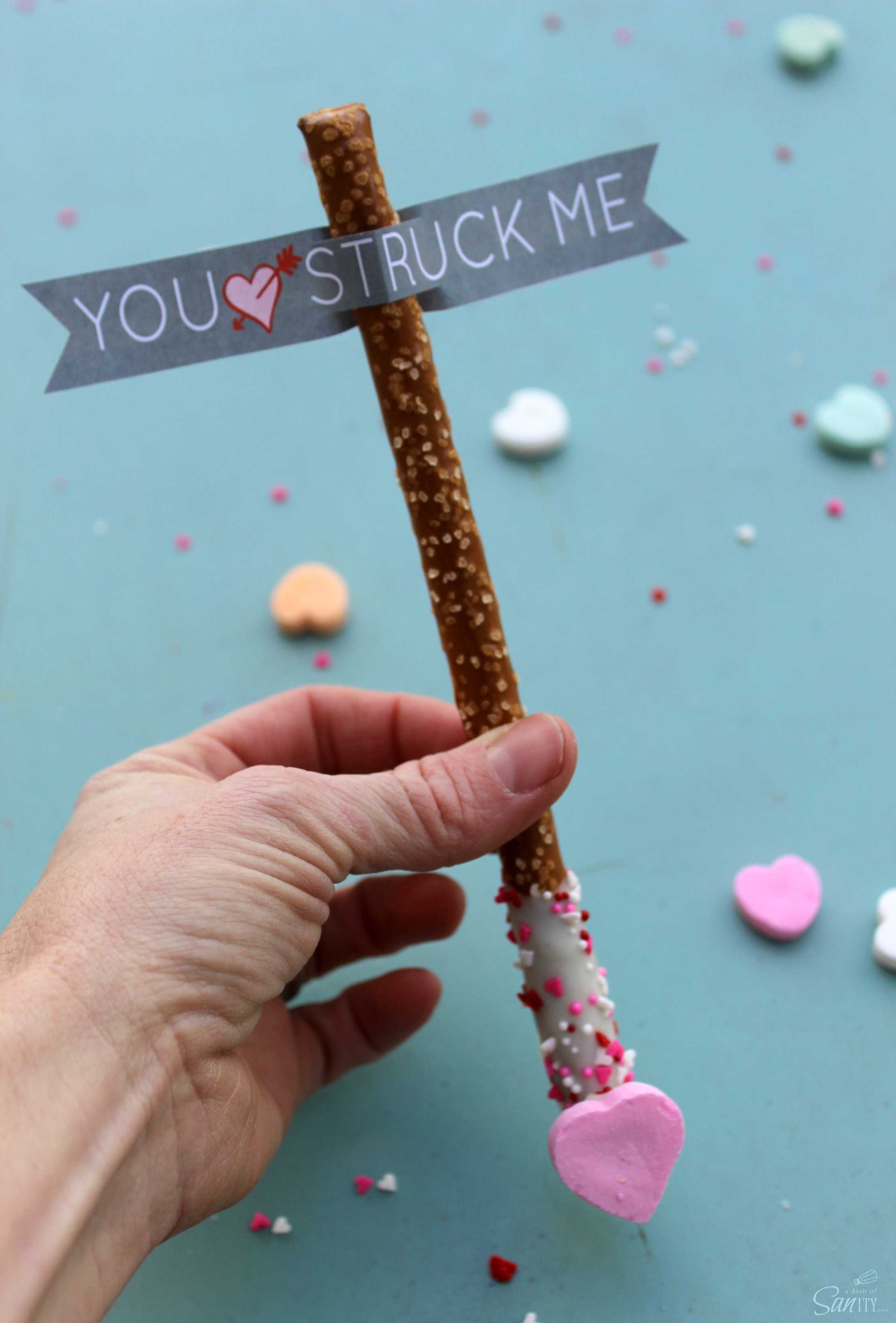 Cupid’s Arrow Pretzel Rods are a fun and festive Valentine’s Day treat. Using Vanilla CandiQuik and conversation candy hearts, these are easy to prepare.