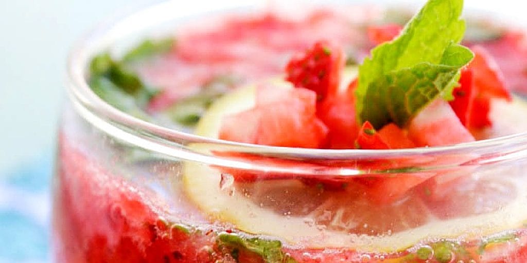 up close of garnish on top of Strawberry Mint Spritzer in a glass