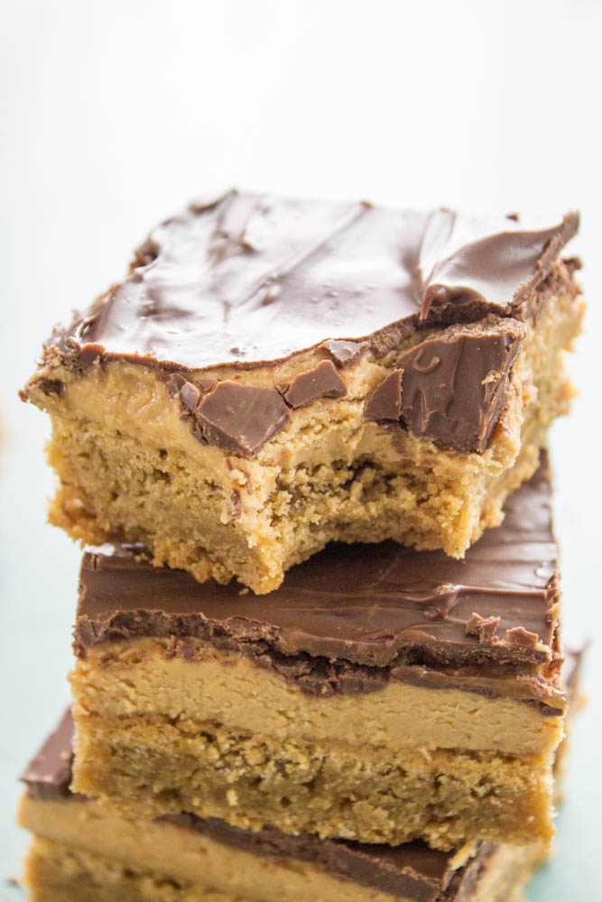 Tagalong Blondies are better than the original Girl Scout Cookies! Creamy peanut butter over a buttery Blondie, finished off with chocolate.