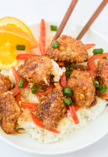 photo of a plate of orange chicken