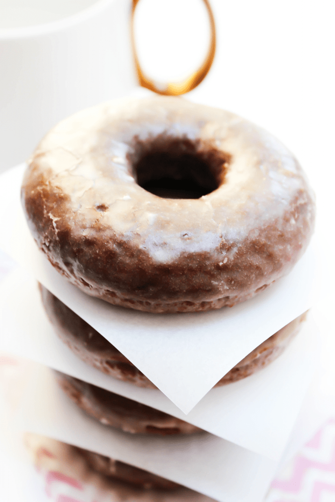 stack of 4 Devil's Food Donuts separated by parchment paper