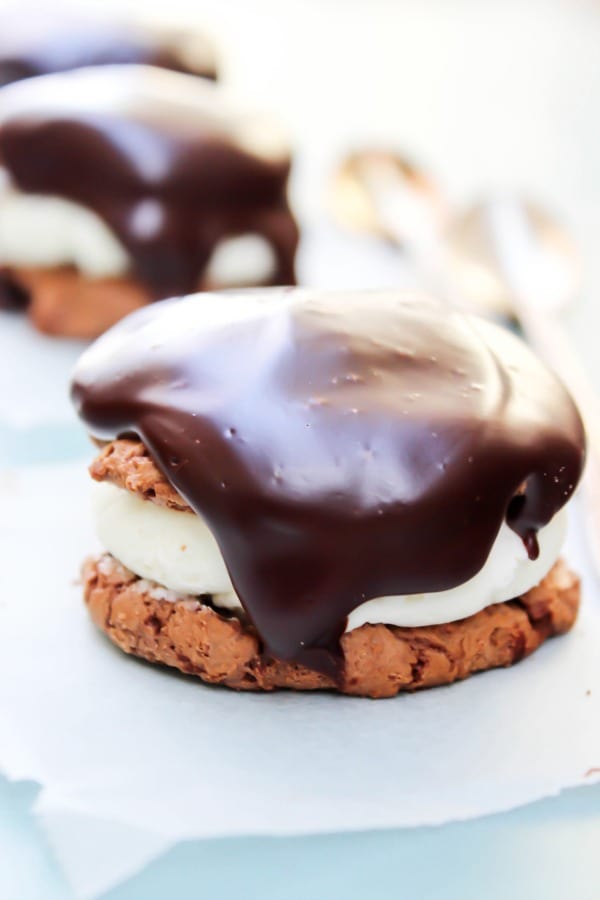 ding dong cookie with parchment paper underneath, cookie topped with ganche