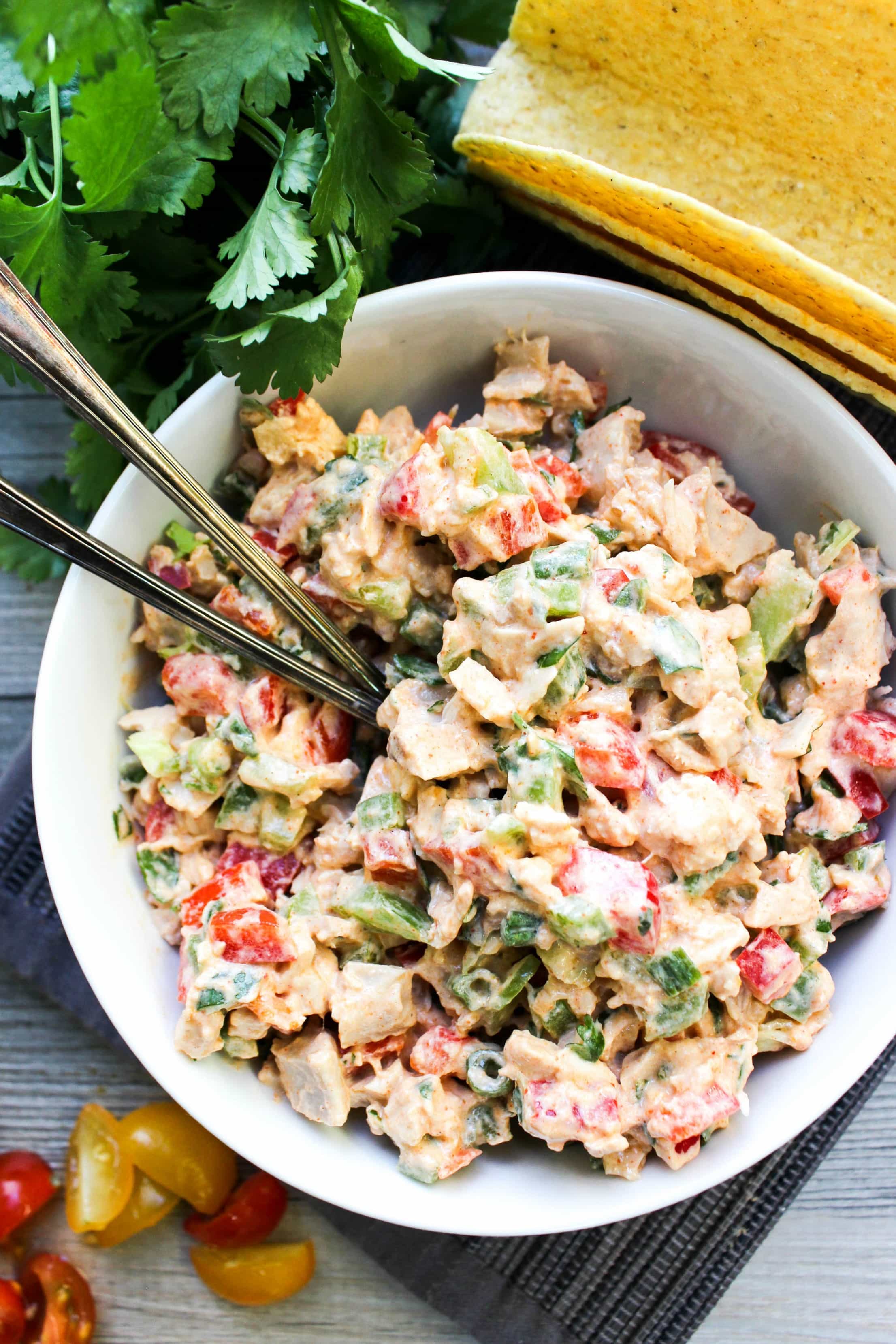 This Santa Fe Chicken Salad is a flavorful chicken salad recipe that's perfect for serving as a dip, in a wrap, as a taco, or tostada.