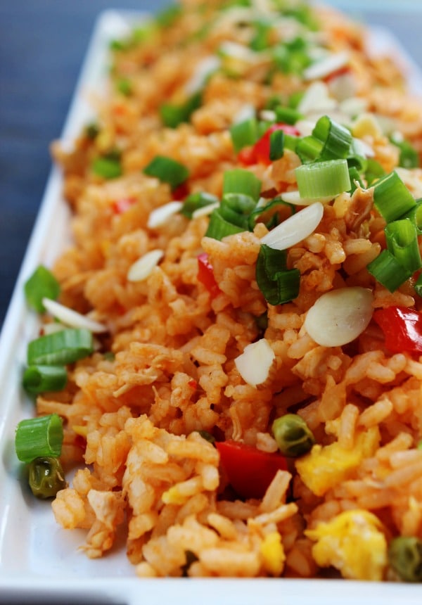 Skip the take-out and make this Sweet & Sour Chicken Fried Rice instead. Two of your favorite take-out dishes made into one easy 30-minute meal.
