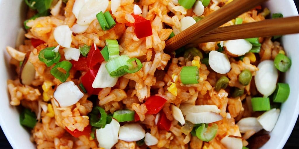 Skip the take-out and make this Sweet & Sour Chicken Fried Rice instead. Two of your favorite take-out dishes made into one easy 30-minute meal.