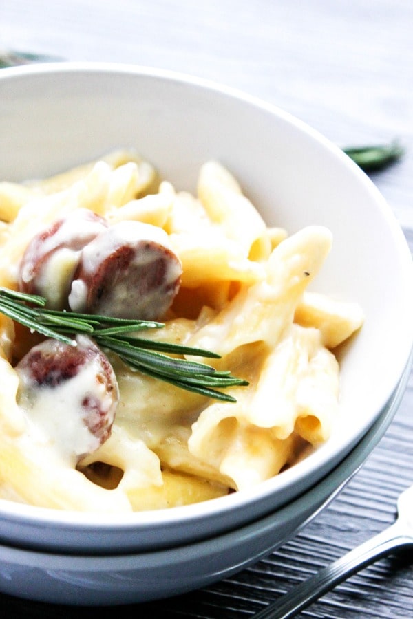 This Cheesy Sausage Pasta is full of creamy sauce, tossed in gluten-free pasta, and sliced sausages. It's an easy weeknight meal that everyone can enjoy.