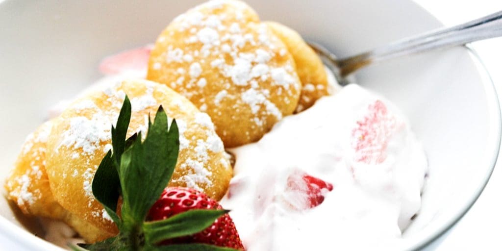 Strawberries & Cream Beignets is a classic dessert made with simple cream and beignets that are so easy to make. Strawberry season has never tasted so good.