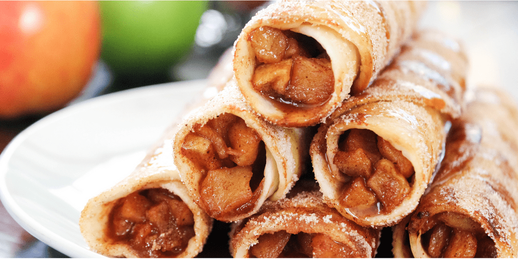 Caramel Apple Pie Taquitos are made with apple pie filling rolled up into a cinnamon sugar crust. It's topped with caramel and slathered with whipped cream.