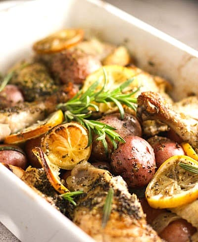 ROASTED LEMON CHICKEN WITH POTATOES AND ROSEMARY.