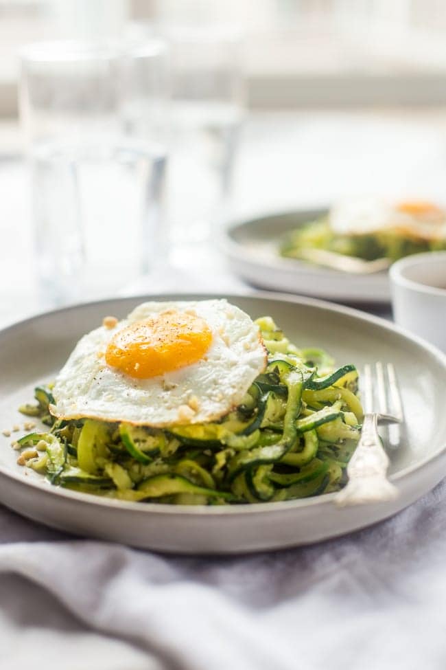 ZUCCHINI NOODLES WITH EVERYTHING PESTO AND FRIED EGGS.