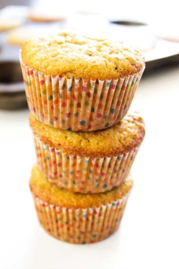 stack of 3 Best Ever Bran Muffins in rainbow polka dot wrappers