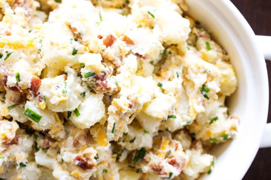 BEST EVER POTATO SALAD RECIPE, bacon, chives, cheddar cheese in white bowl