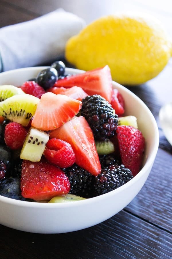berry fruit salad in a white bowl.