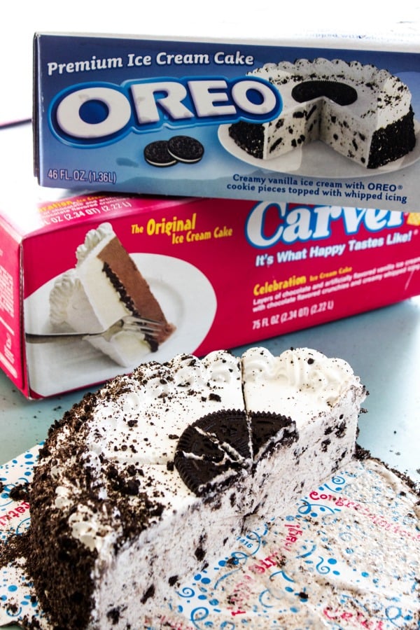 COOKIES & CREAM HOT FUDGE SAUCE - Half eaten cake on blue table, products in background 