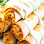 BAKED TACO RANCH TAQUITOS - Filled with a cheesy taco ranch chicken and then baked to perfection, they are perfect for any game day or holiday get together.