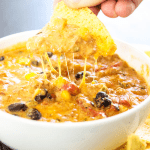 SLOW COOKER CHILI CHEESE DIP – cheesy and full of flavor, this easy recipe will score a win on game day and be a hit during the holidays.