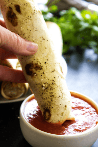 CHICKEN PARMESAN TAQUITOS - Filled with chicken, 3 cheeses and Italian seasoning, dunk these taquitos in a marinara sauce and you have an easier & simpler twist on an Italian classic.