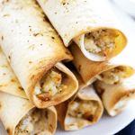 Chicken Parmesan Taquitos - Filled with chicken, cheeses & Italian seasoning, dunk in a marinara sauce & you have a simpler twist on an Italian classic.