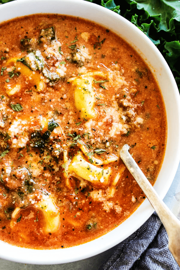 SLOW COOKER TUSCAN TORTELLINI SOUP above with spoon