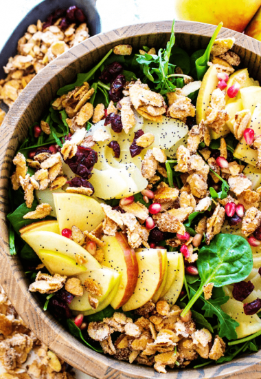 SPINACH SALAD WITH APPLES, PEARS, CRANBERRIES & CANDIED ALMONDS is not only easy & delicious, it also makes a gorgeous addition to the table setting.