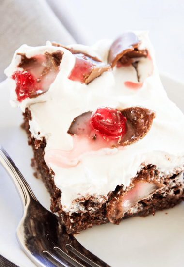 CHOCOLATE COVERED CHERRY POKE CAKE - A rich & gooey chocolate cake with chocolate covered cherries; spread some holiday cheer with this simple dessert.