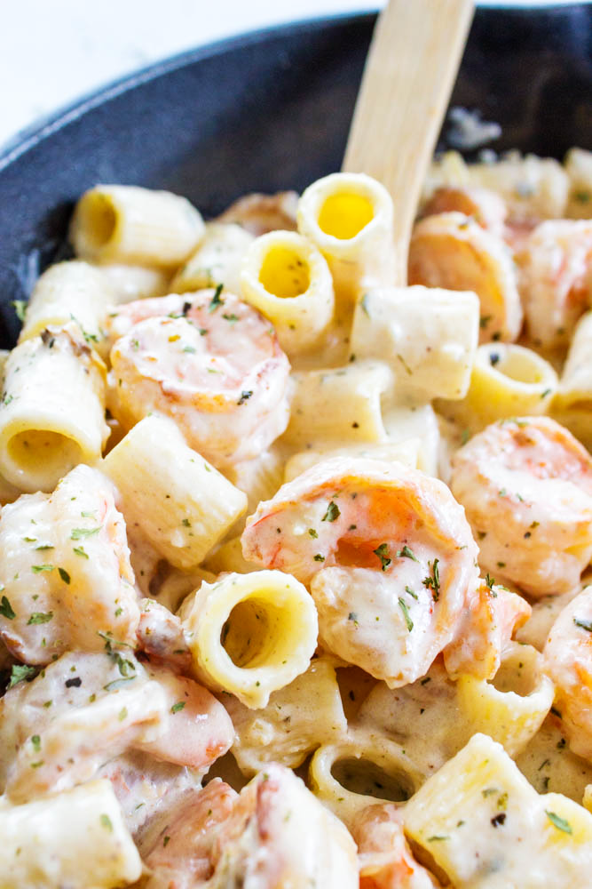 shrimp alfredo with pasta in a bowl
