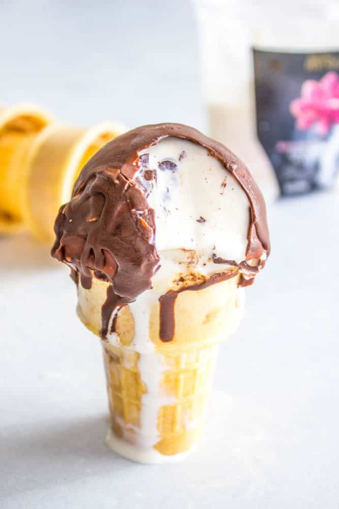 HARD SHELL CHOCOLATE on ice cream cone with bite taken