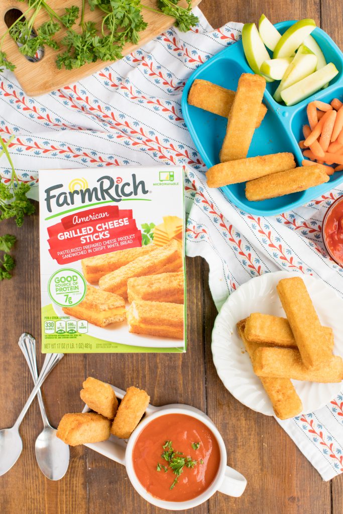 photo of farmrich grilled cheese sticks box with cheese sticks on a plate, on a kid's plate with apples and carrots, and in a bowl with tomato soup