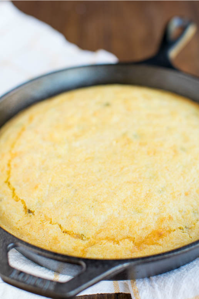 photo of cornbread in a cast iron skillet on a table