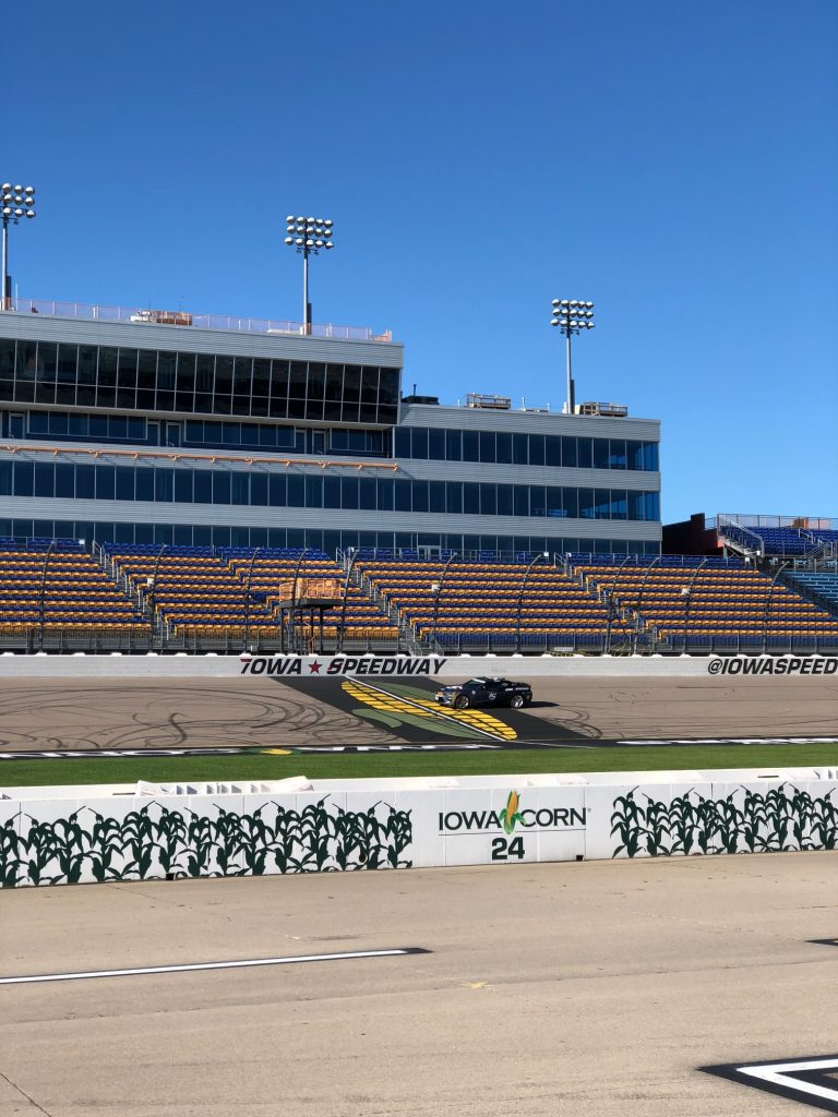 Photo of the iowa speedway with iowa corn signs on side of the track