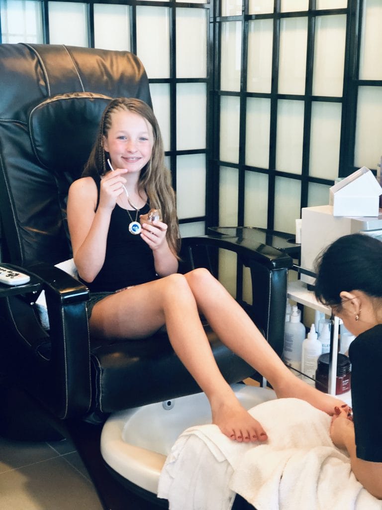 photo of jordan eating a treat while getting a pedicure 