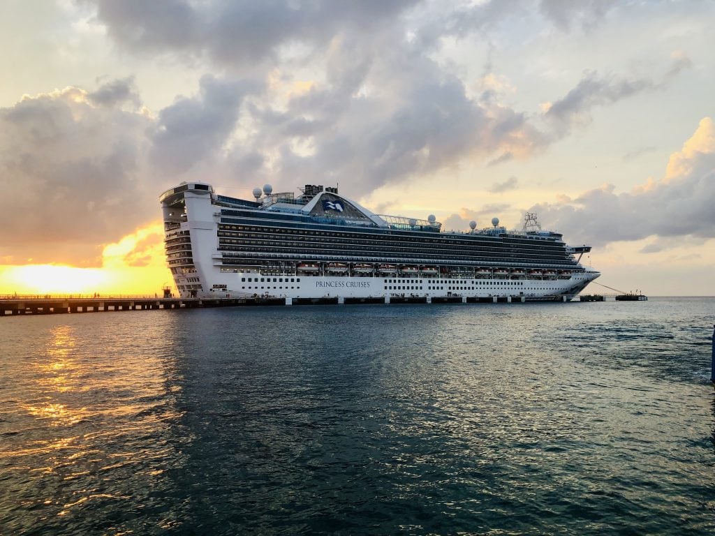 photo of princess cruises cruise ship at a dock at sunset