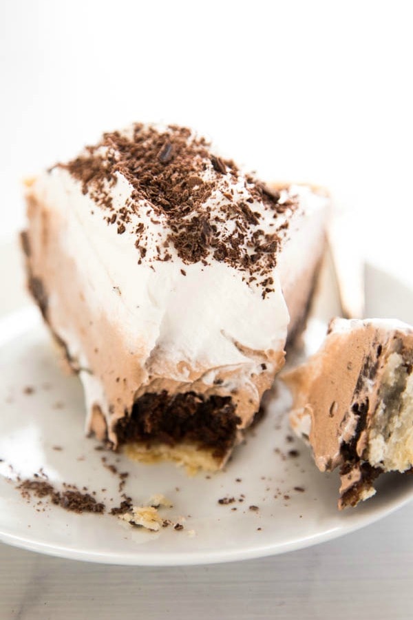 photo of plate with slice of Chocolate Mousse Fudge Pie with a bite on a fork