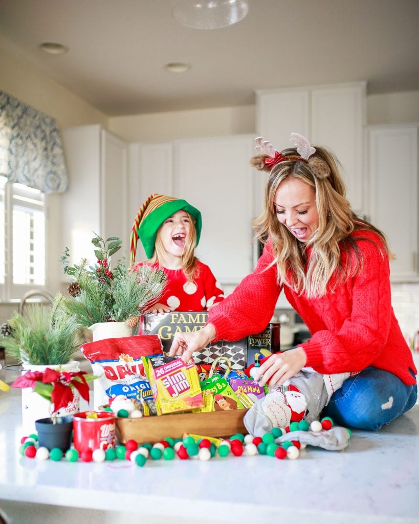 photo of mom and daughter opening the Game Night Gift Basket