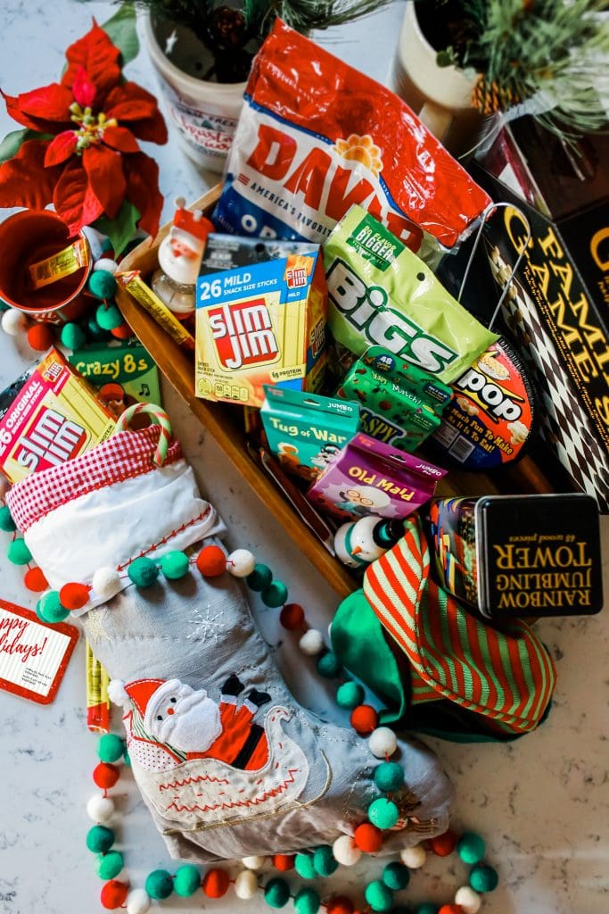 overhead photo of Game Night Gift Basket with full stocking next to it