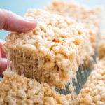 photo of a rice krispie treat being lifted out of the pan