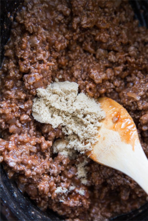 photo of the brown sugar being added to the slow cooker