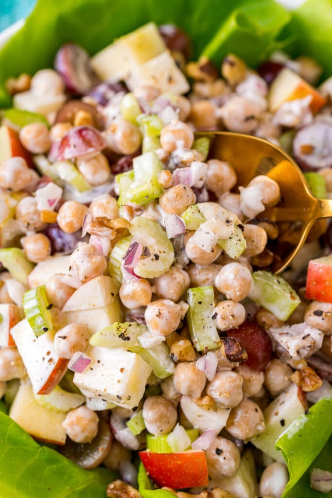 chickpea waldorf salad in bowl with lettuce