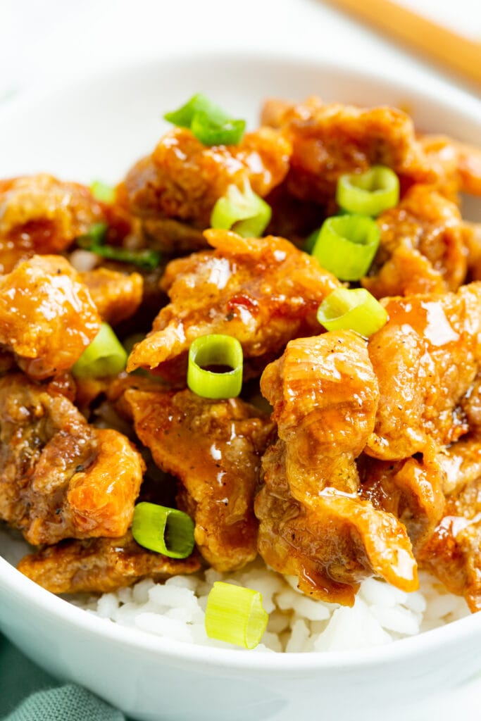 crispy honey chicken in a bowl with rice.