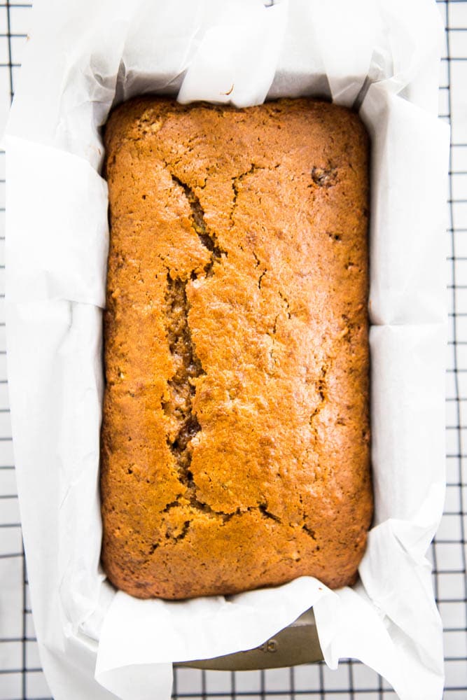 baked loaf of pumpkin zucchini bread in a pan.