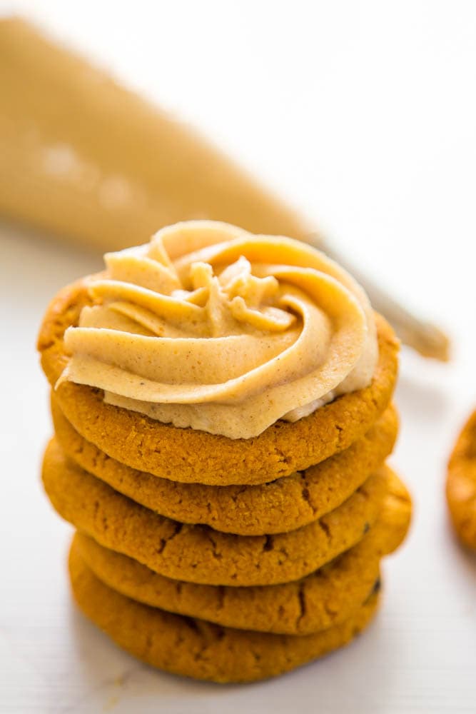 stack of cookies with frosting on top.