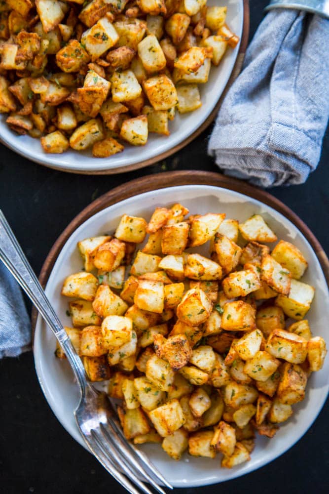 overhead shot of two plates of potatoes